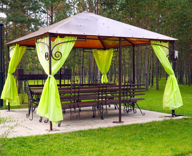 Empty gazebo or tent in a green Park. A place to relax in the Park